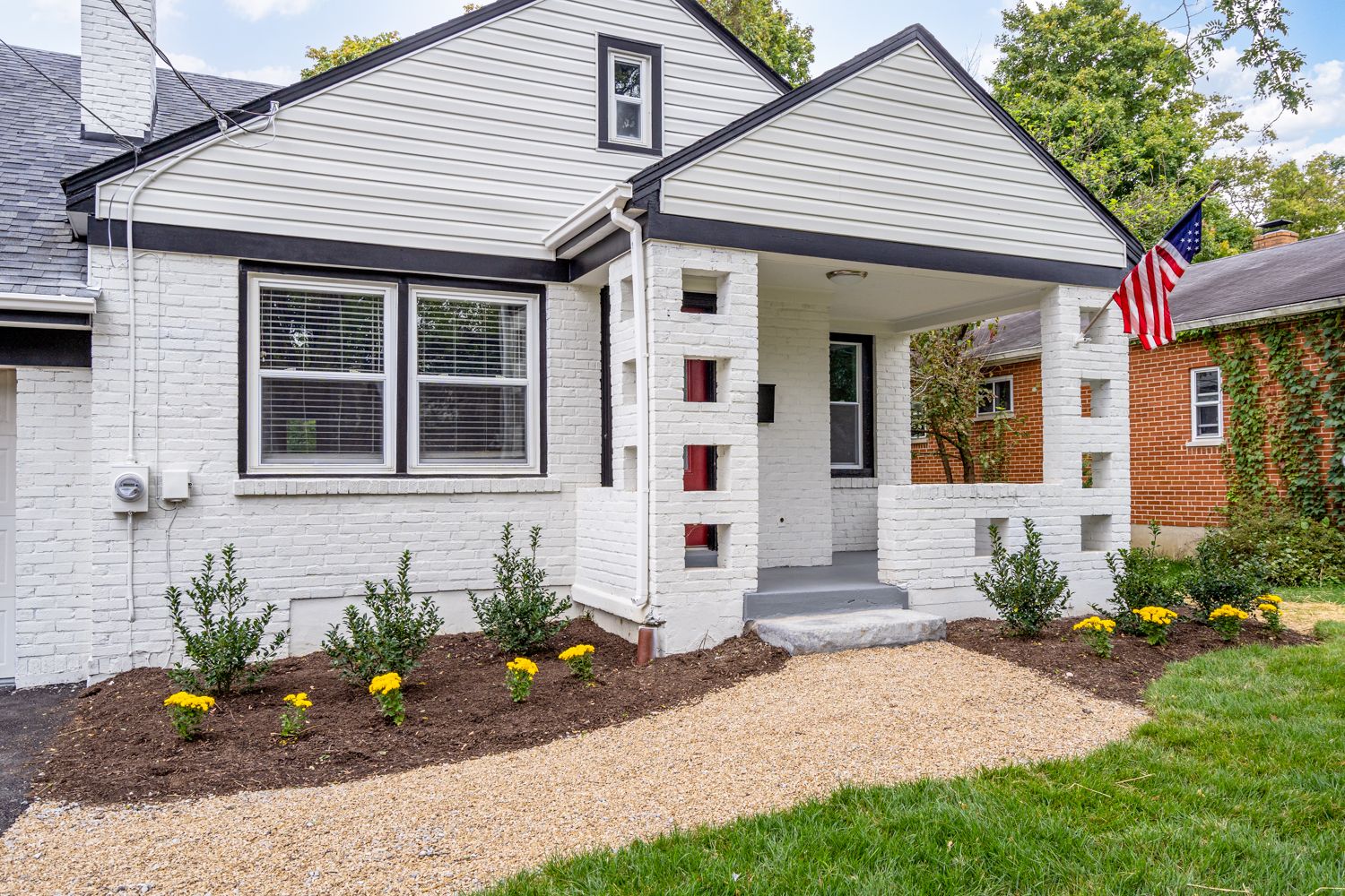 Cottage entry porch with new columns and plantings