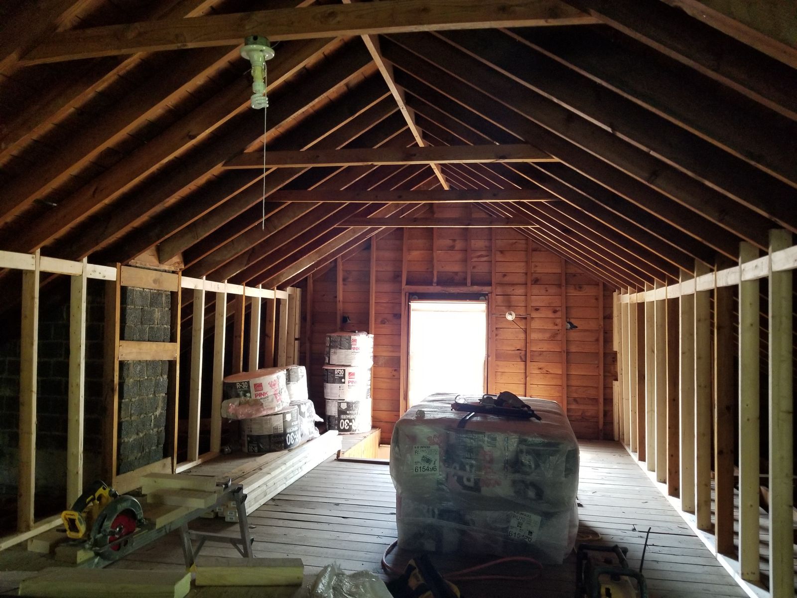 Attic stripped to exposed rafters before renovation