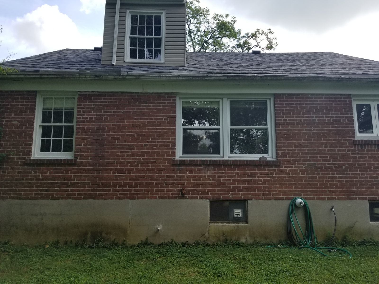Brick rear exterior before renovation with no deck