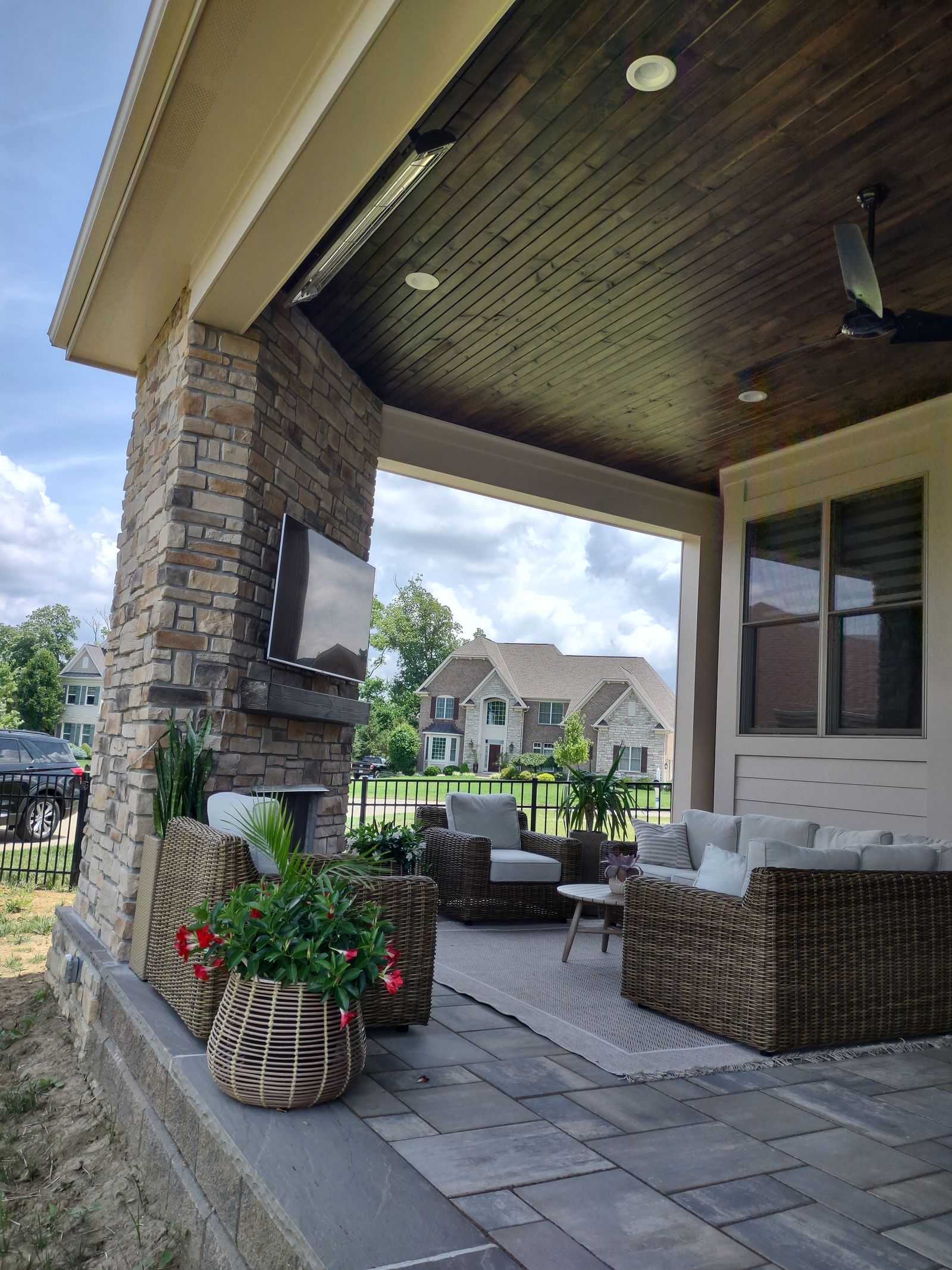 Covered porch with ceiling fan and view to the lawn