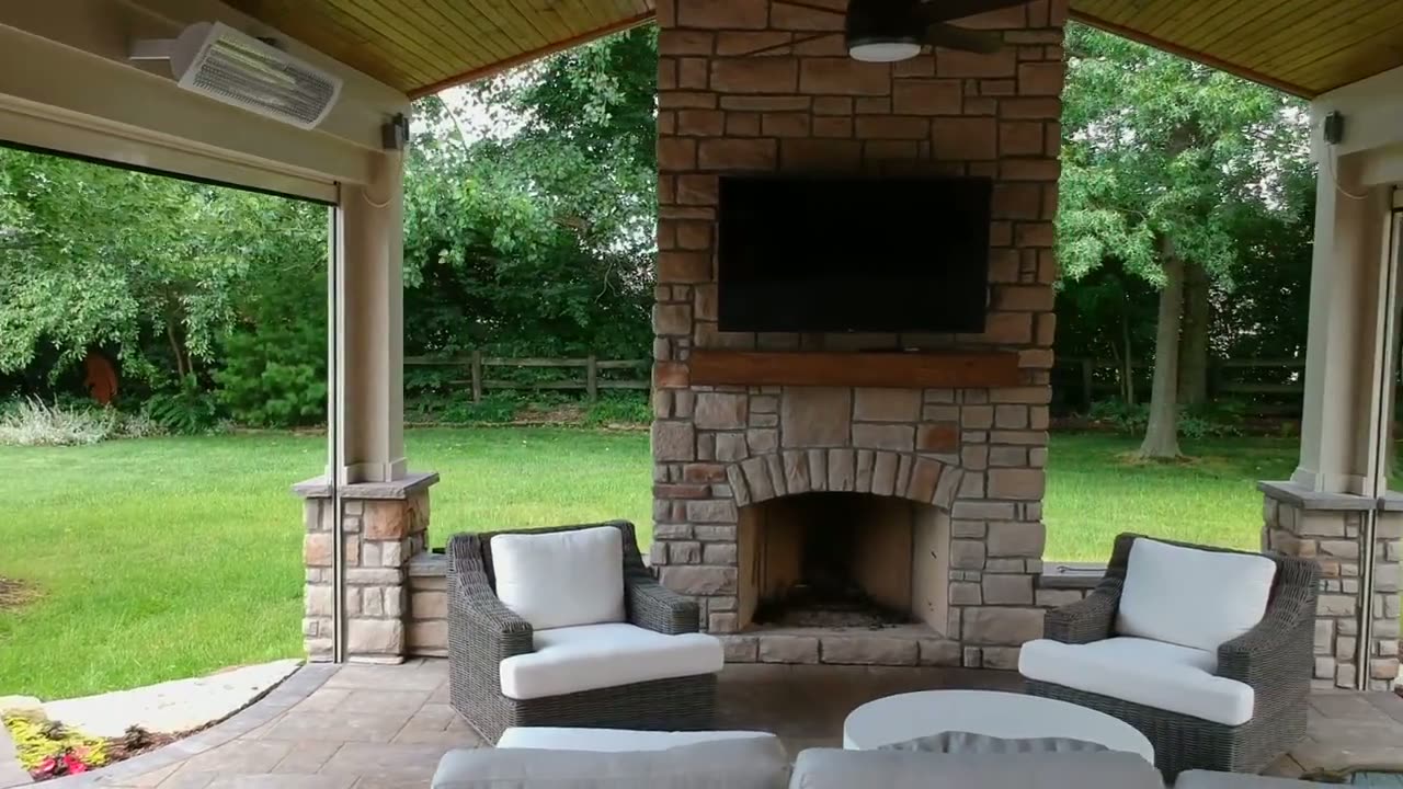 Demo-to-finish look at a backyard transformation with fireplace porch and hot tub deck.