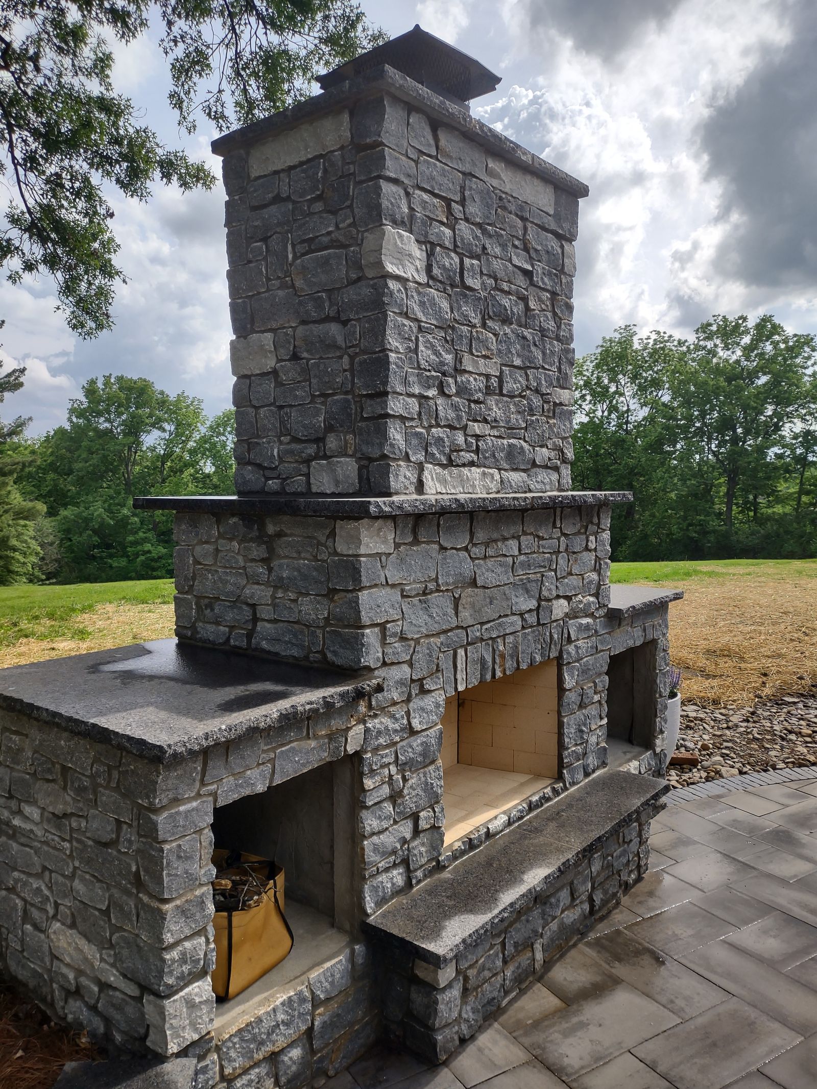 Stone fireplace detail with herringbone firebox