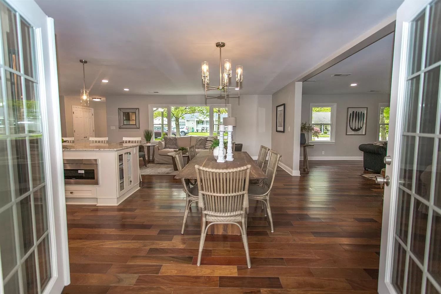 Renovated ranch kitchen with island seating and pendant lighting