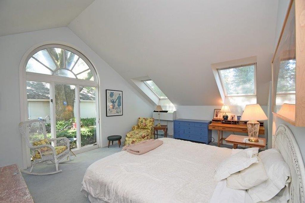 Dated vaulted master bedroom before renovation