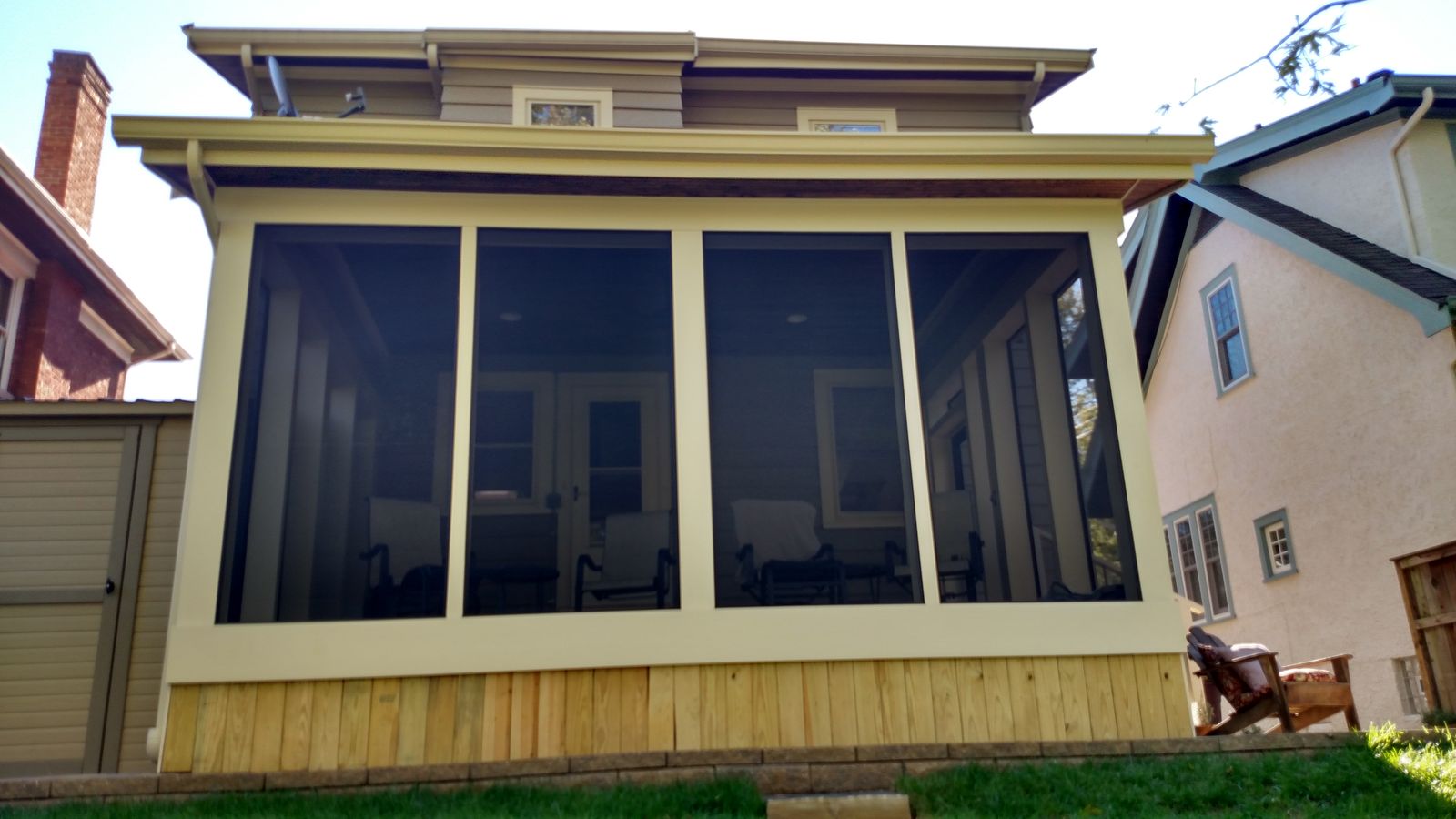 Screened porch addition matched to the home's siding and trim
