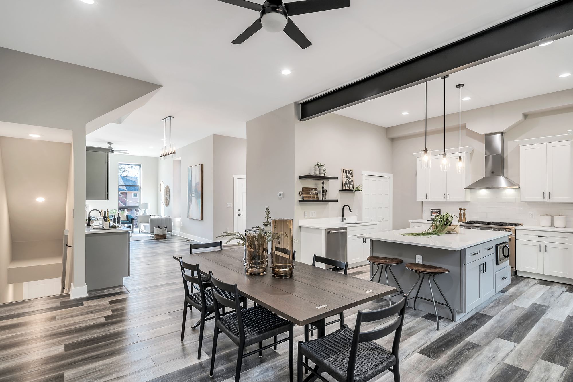 Renovated open kitchen and dining room with exposed steel beam