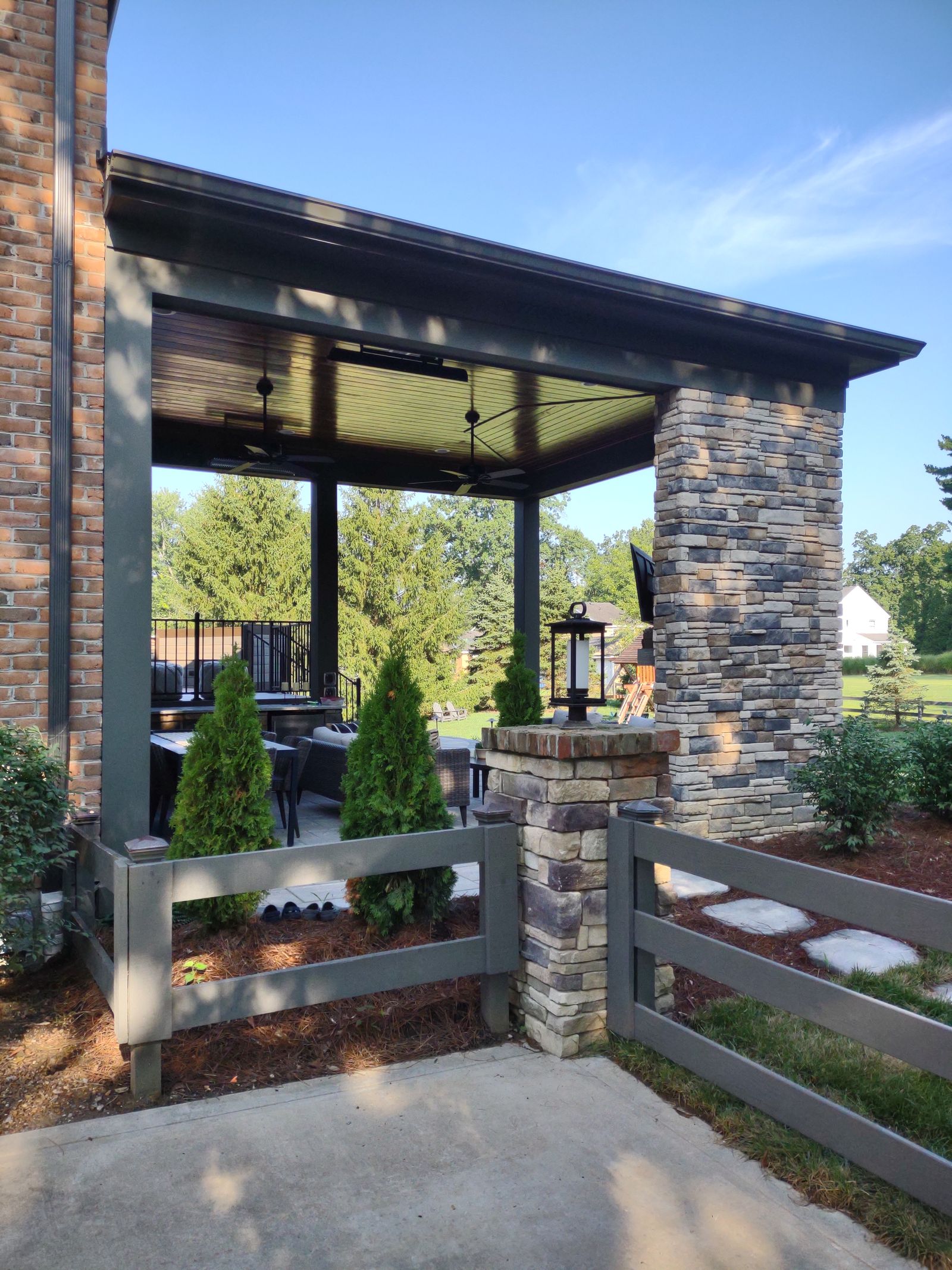 Upper deck lounge with outdoor sofa and steel railings