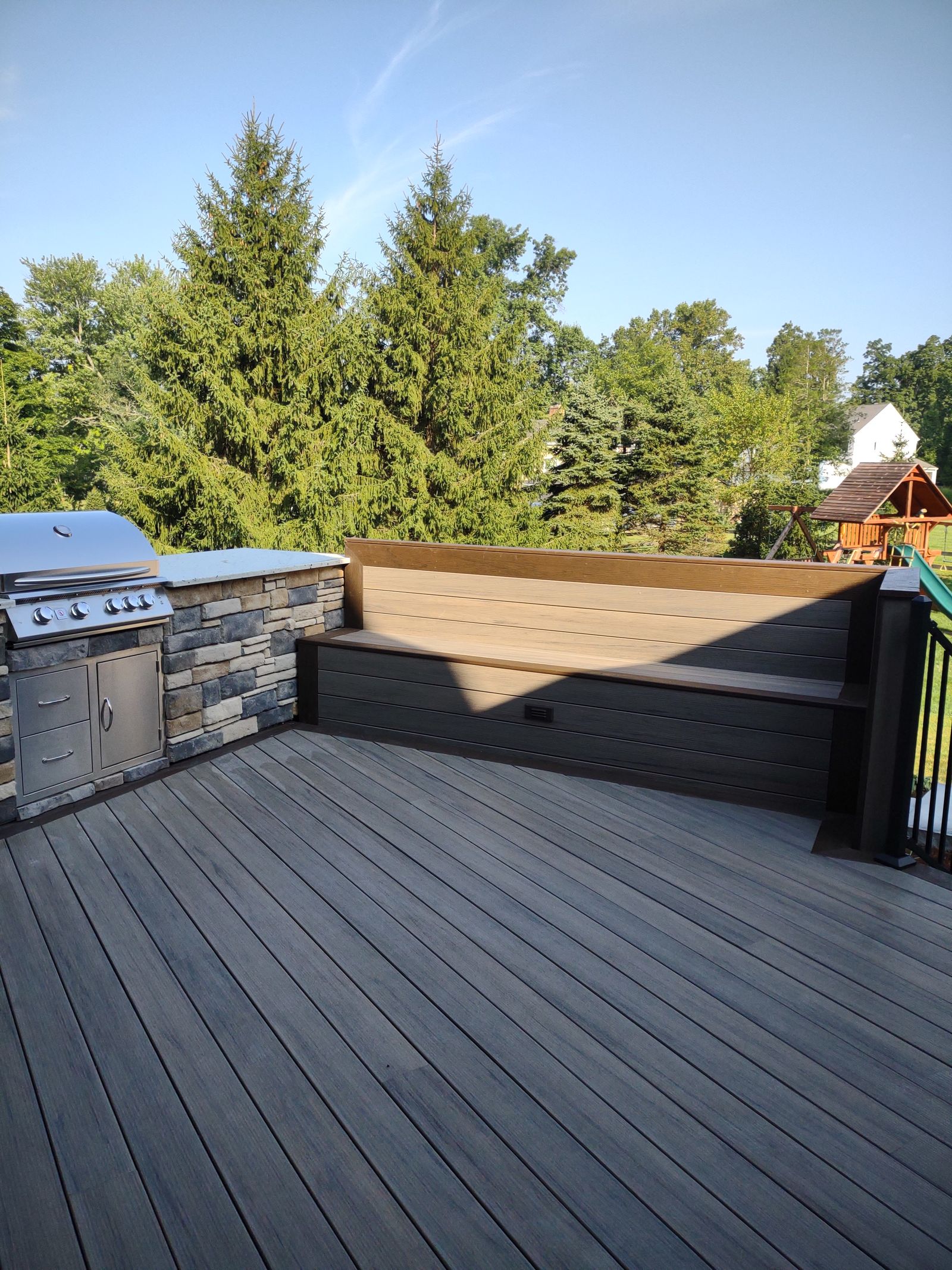 Upper composite deck with built-in grill and hot tub