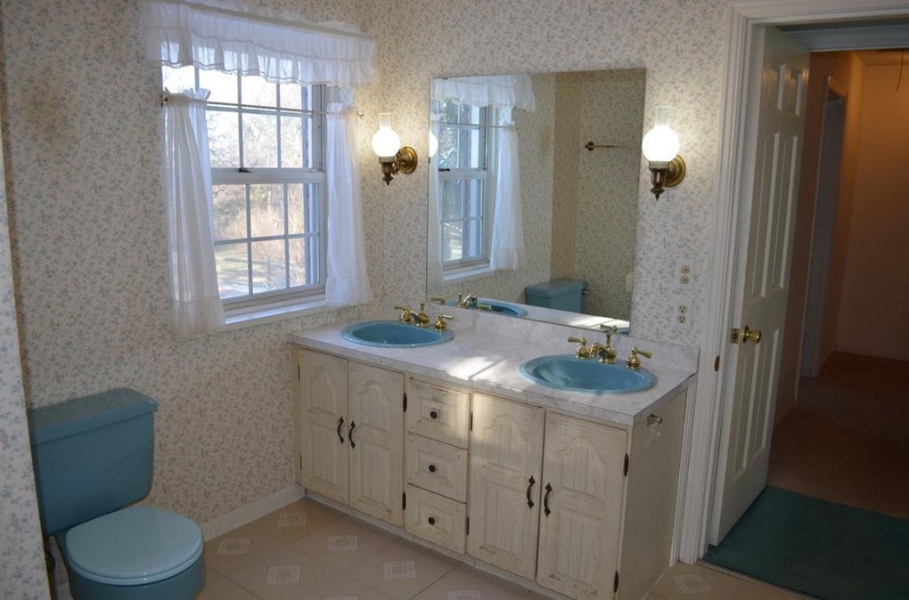 Original hall bath with blue fixtures before renovation