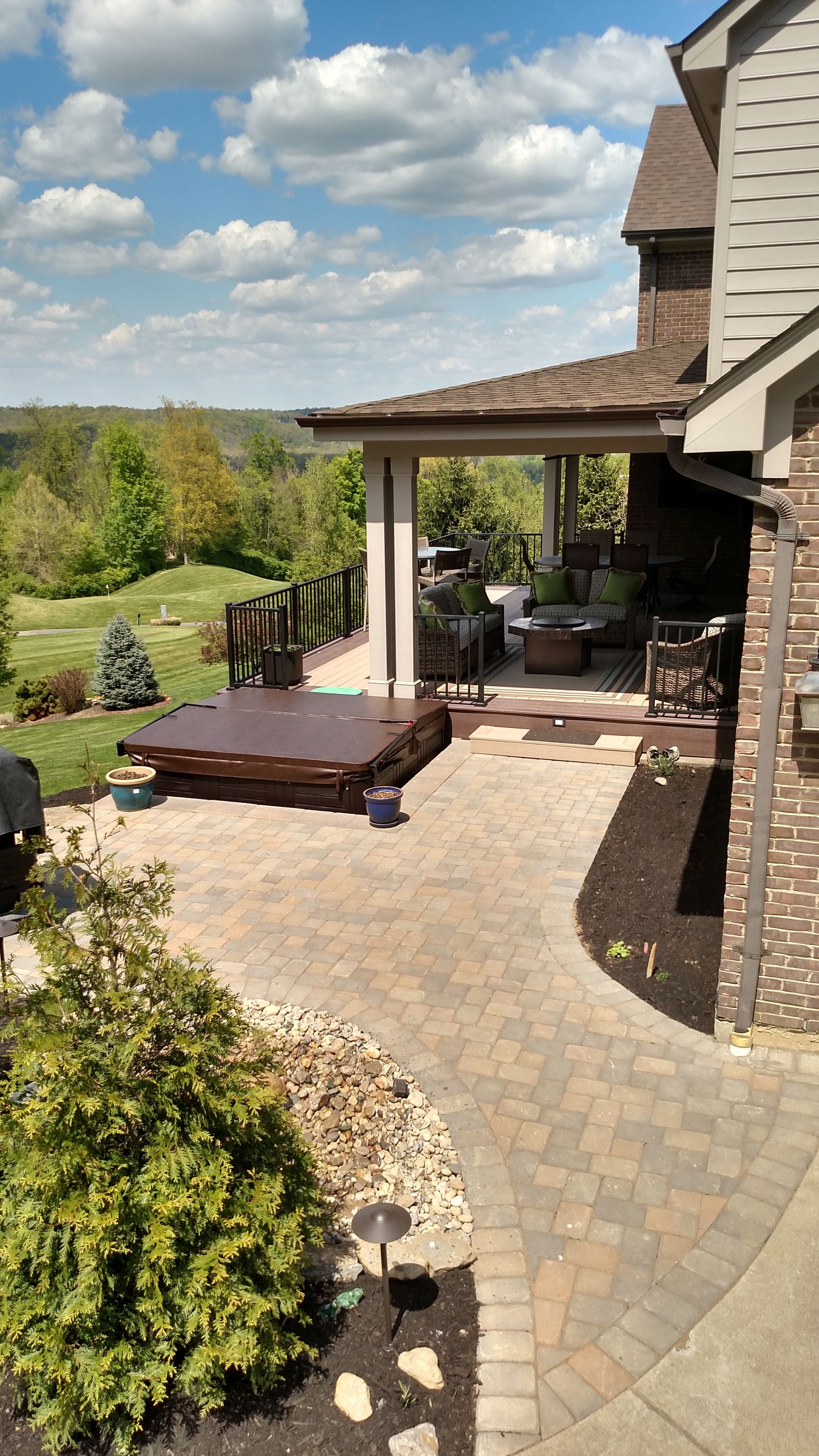 Paver walkway connecting deck and spa terraces