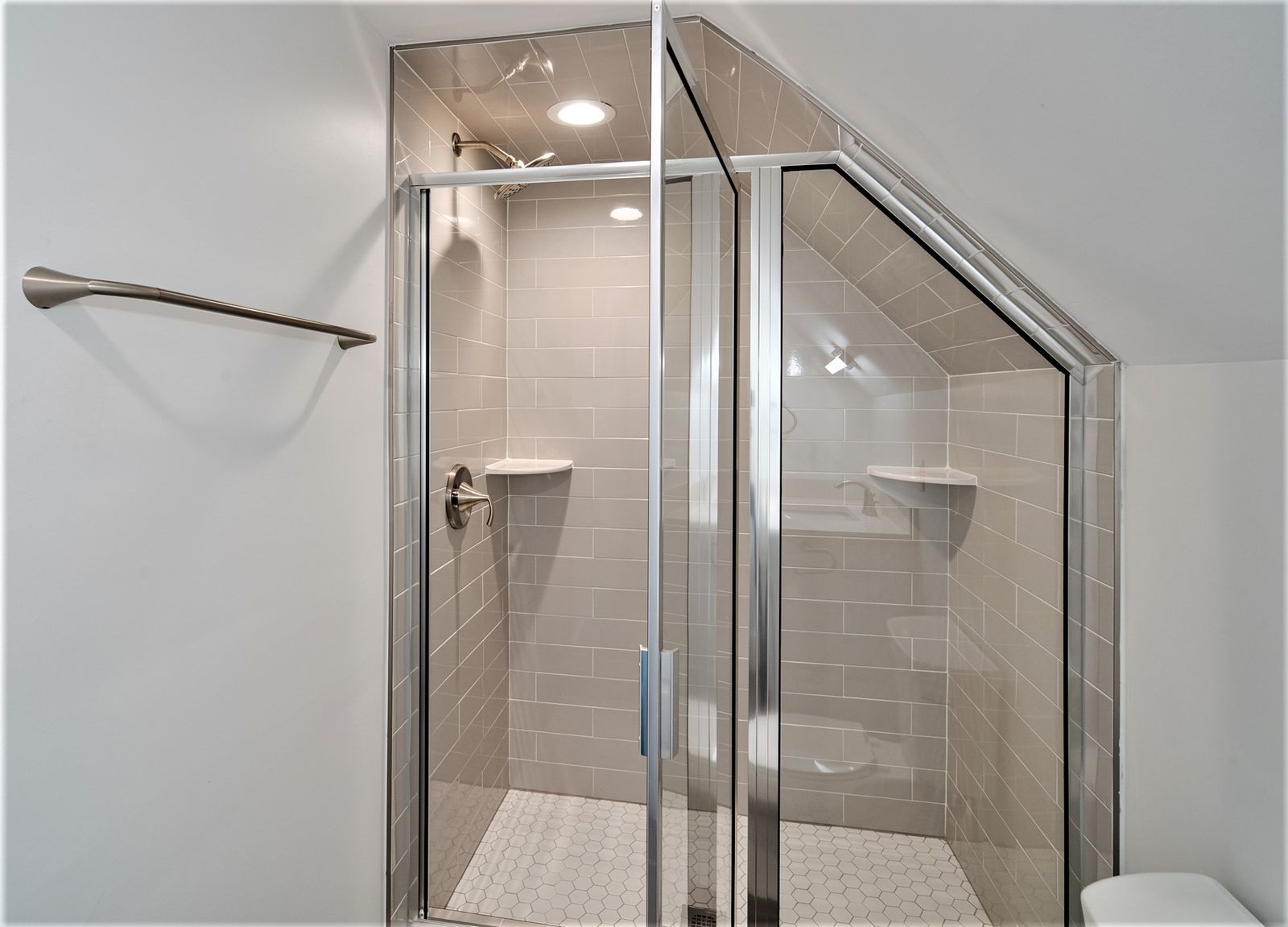 Third-floor bath with angled glass shower enclosure